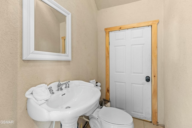 bathroom with sink and toilet