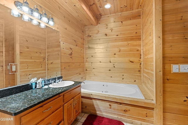 bathroom with vanity, a tub, wooden ceiling, and wood walls