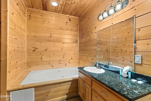 bathroom featuring vanity, a washtub, wood ceiling, and wood walls