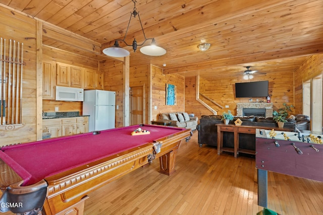 rec room with wood ceiling, ceiling fan, wooden walls, pool table, and light wood-type flooring