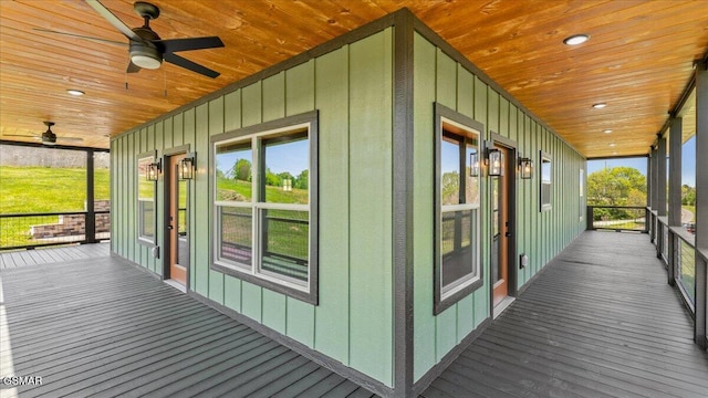 unfurnished sunroom featuring a wealth of natural light and ceiling fan