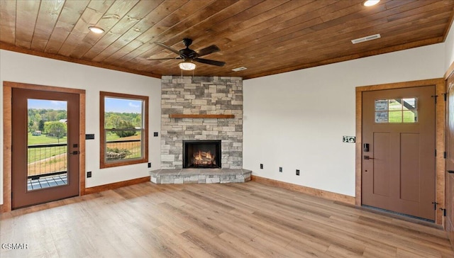 unfurnished living room featuring wood finished floors, a healthy amount of sunlight, a ceiling fan, and wooden ceiling