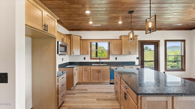 kitchen featuring a sink, stainless steel appliances, a kitchen island, wooden ceiling, and light wood finished floors