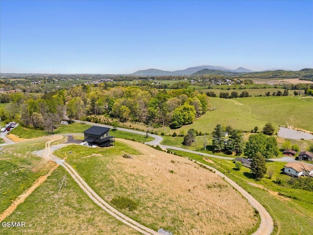 aerial view featuring a mountain view and a rural view