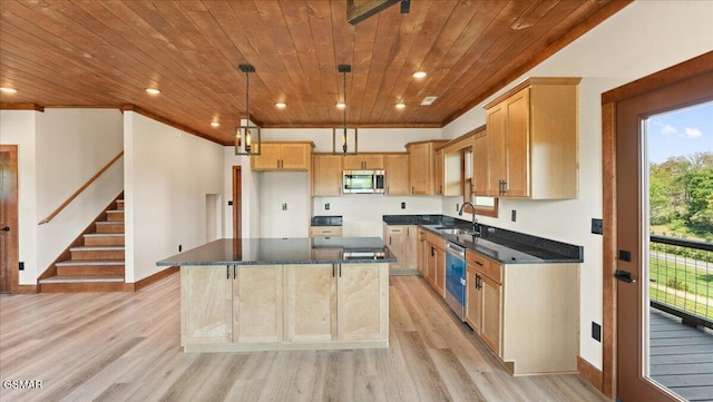 kitchen featuring light wood-style floors, a sink, appliances with stainless steel finishes, and wood ceiling