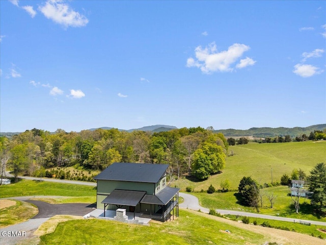 birds eye view of property with a mountain view