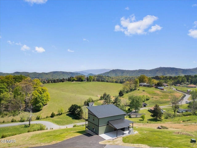 aerial view featuring a rural view and a mountain view