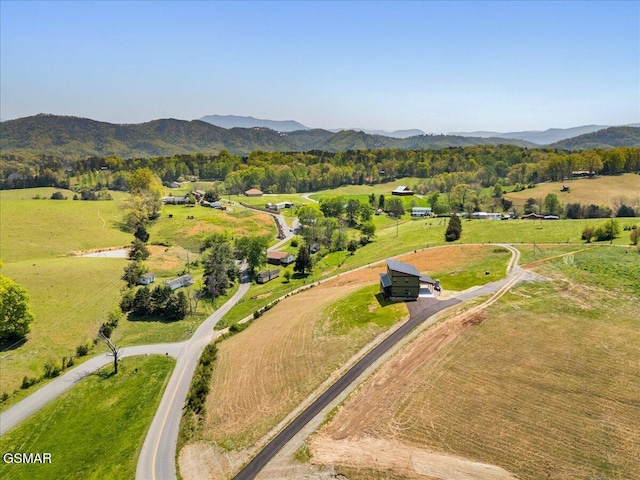 drone / aerial view featuring a rural view and a mountain view