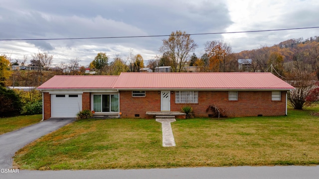 single story home with a front yard and a garage