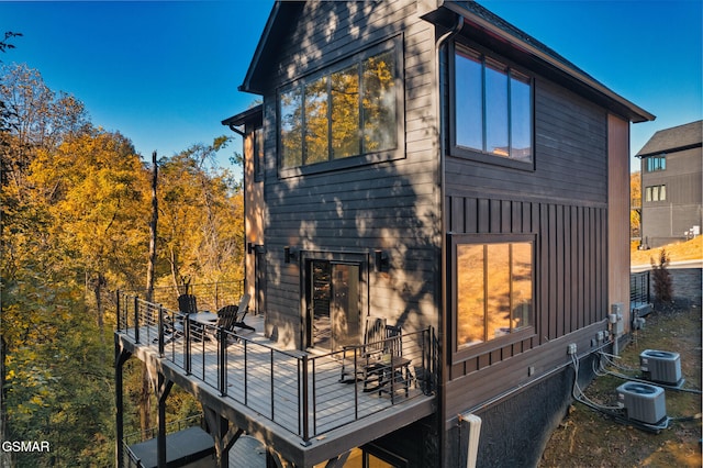 view of home's exterior featuring central AC unit and a balcony