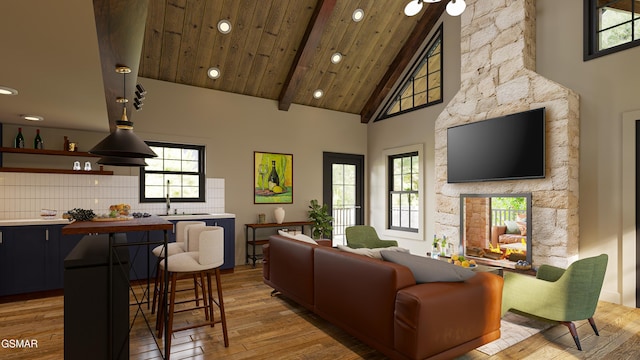- Stepping Stone Road, Sevierville, TN 37862 - living room with high vaulted ceiling, recessed lighting, light wood-style floors, healthy amount of natural light, and beamed ceiling