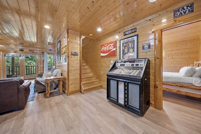 interior space featuring wood ceiling, light hardwood / wood-style floors, and wood walls