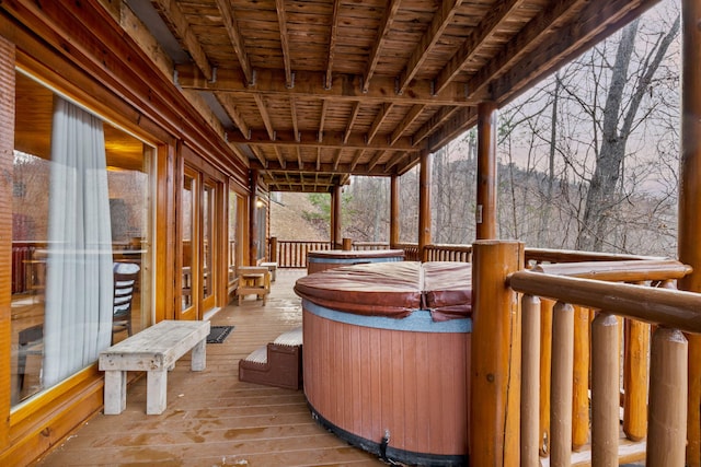 wooden terrace with a hot tub