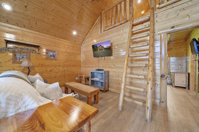 living room with wood walls, wood ceiling, high vaulted ceiling, light wood-type flooring, and log walls