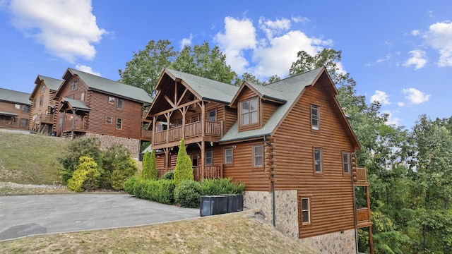 back of house with a balcony