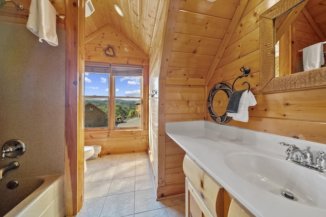 bathroom with lofted ceiling, toilet, and wood walls