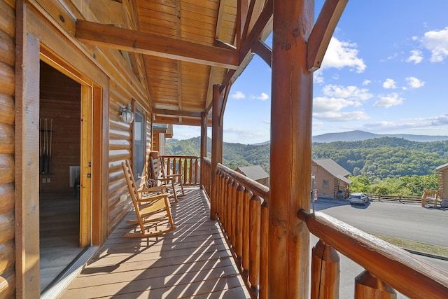 wooden terrace with a mountain view