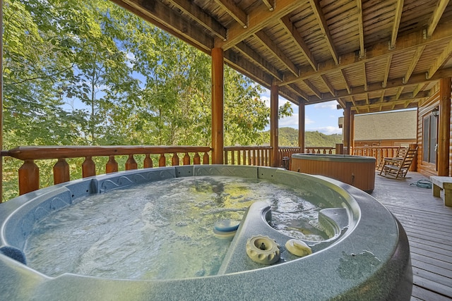 deck with a hot tub