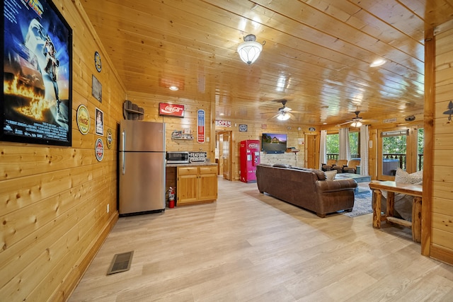 living room with wood ceiling, light hardwood / wood-style floors, and wood walls