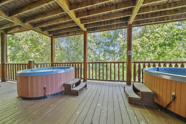 wooden terrace with a hot tub