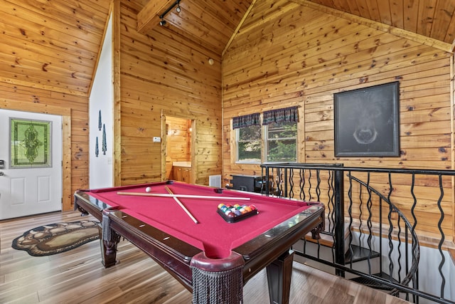 recreation room featuring wood-type flooring, wooden walls, and billiards