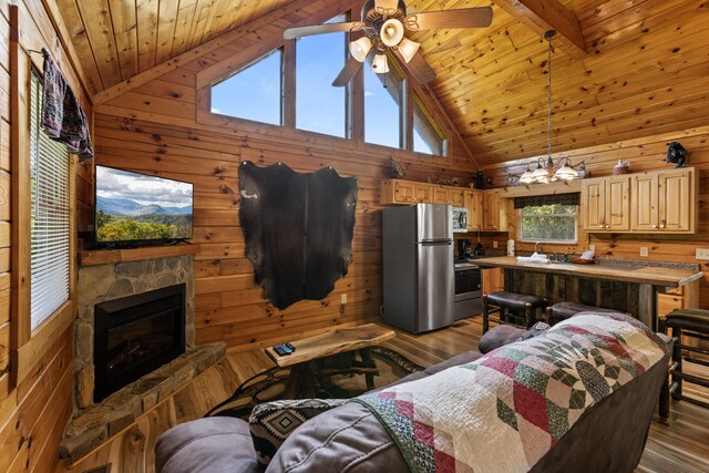 living room with wood-type flooring, wood ceiling, and wood walls