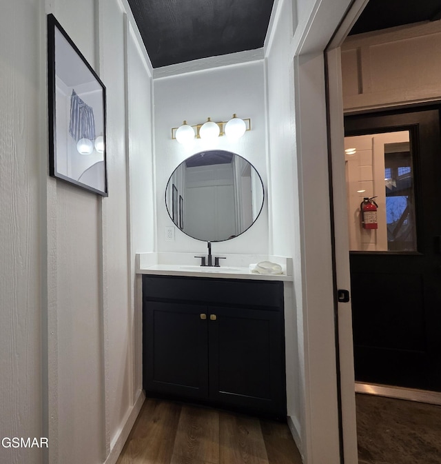 bathroom featuring vanity and wood finished floors