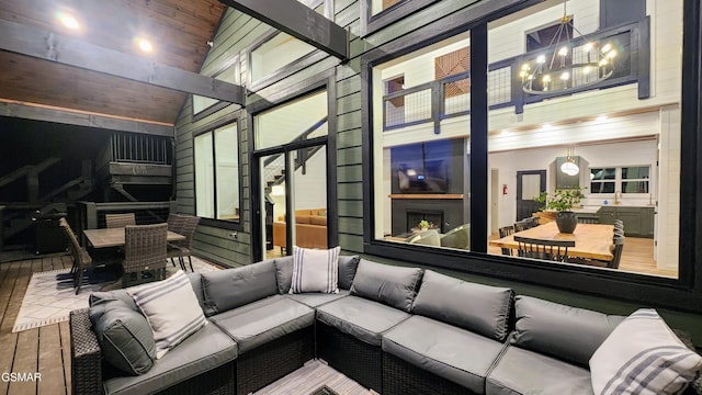 living room featuring hardwood / wood-style floors and a towering ceiling