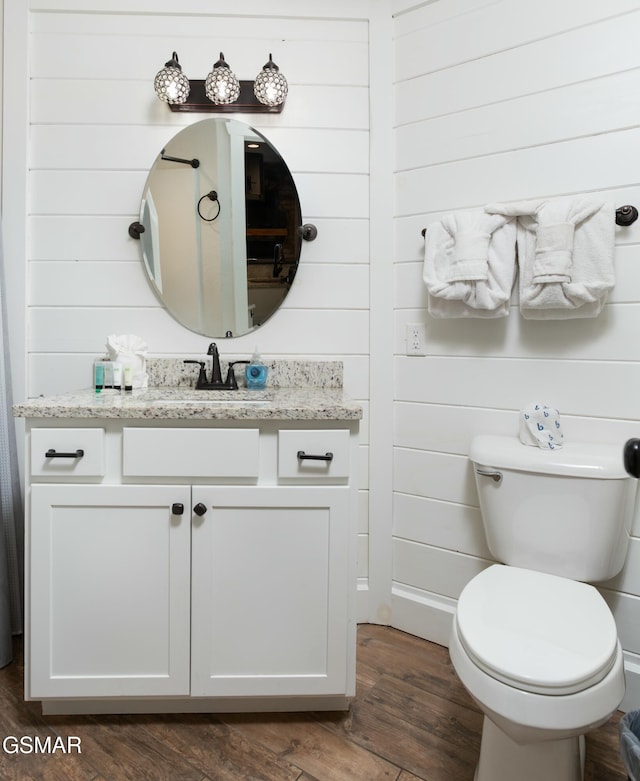 145 W Holly Ridge Rd, Gatlinburg, TN 37738 - bathroom with toilet, vanity, and wood finished floors