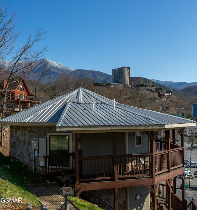 145 W Holly Ridge Rd, Gatlinburg, TN 37738 - back of house with a mountain view, metal roof, stone siding, and central AC