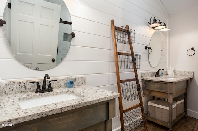 145 W Holly Ridge Rd, Gatlinburg, TN 37738 - bathroom featuring wood finished floors, vanity, and vaulted ceiling