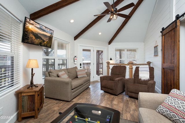 145 W Holly Ridge Rd, Gatlinburg, TN 37738 - living area featuring wood finished floors, a barn door, lofted ceiling with beams, and a ceiling fan