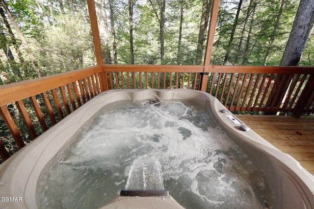 deck with a hot tub