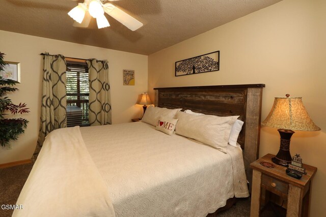 bedroom featuring carpet flooring, ceiling fan, and a textured ceiling