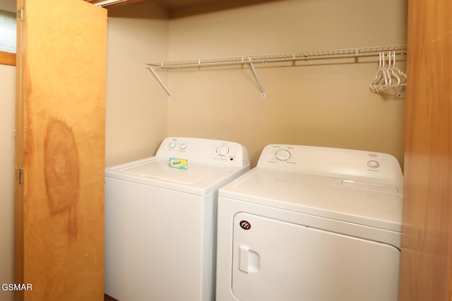 laundry area with separate washer and dryer