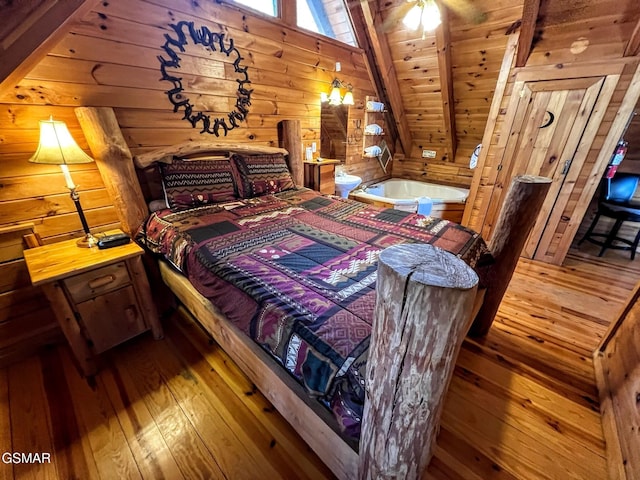 bedroom with wooden walls, wood ceiling, and hardwood / wood-style floors