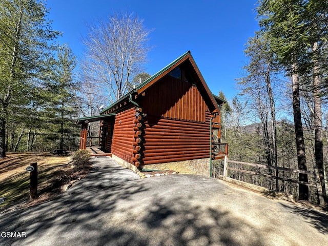 view of home's exterior featuring log siding