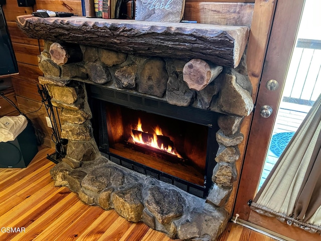 room details with a fireplace and wood finished floors