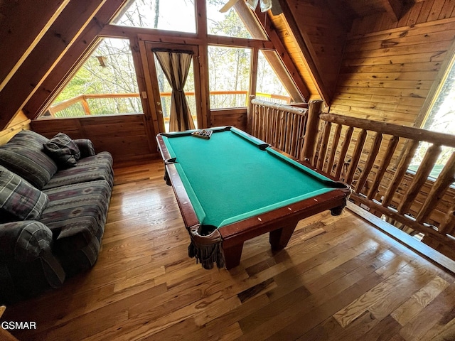 playroom featuring hardwood / wood-style floors, lofted ceiling, wooden walls, and billiards