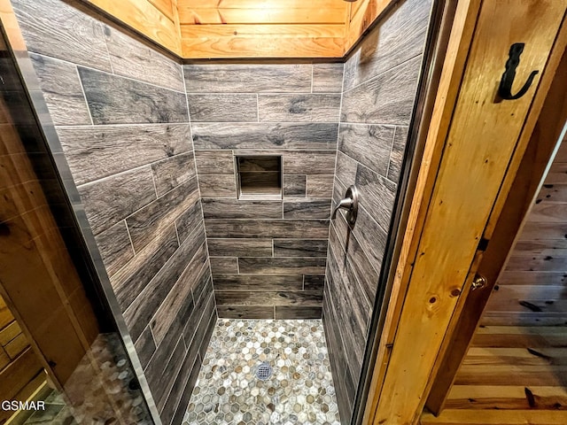 bathroom with tiled shower