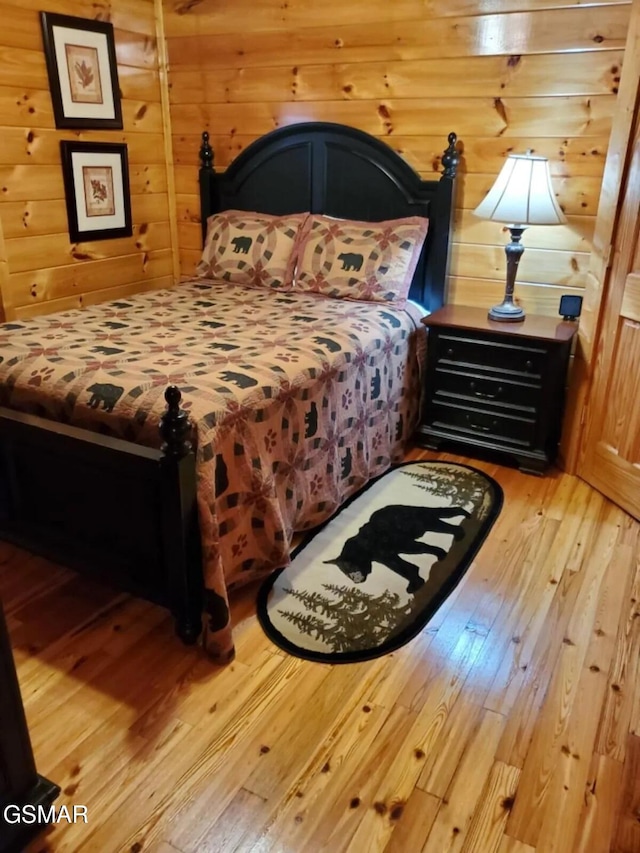 4610 High Vista Way, Pigeon Forge, TN 37863 - bedroom with light wood-style flooring and wooden walls