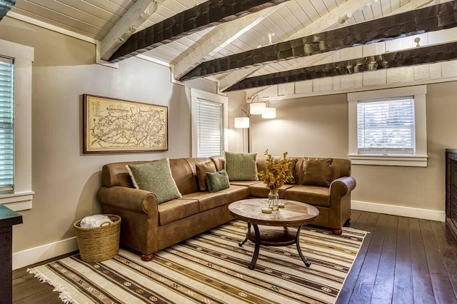 living room with baseboards, lofted ceiling with beams, wooden ceiling, and hardwood / wood-style flooring