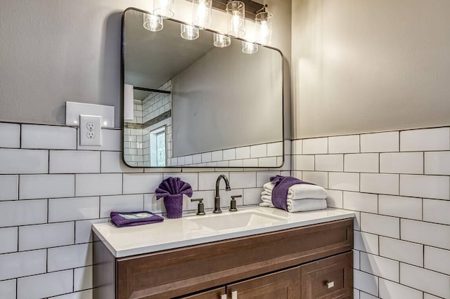 bathroom featuring vanity, backsplash, and tile walls