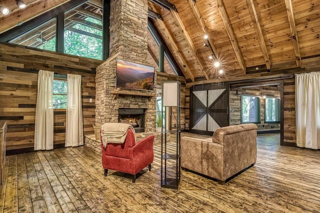 living area featuring high vaulted ceiling, wood walls, wooden ceiling, and hardwood / wood-style flooring