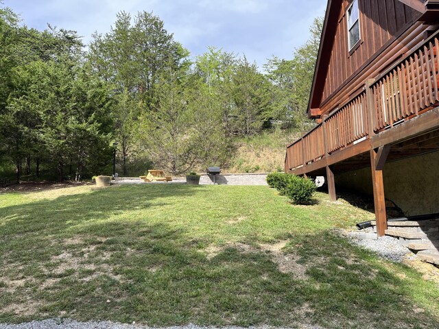 view of yard with a wooden deck