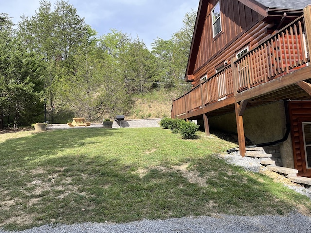 view of yard with a wooden deck