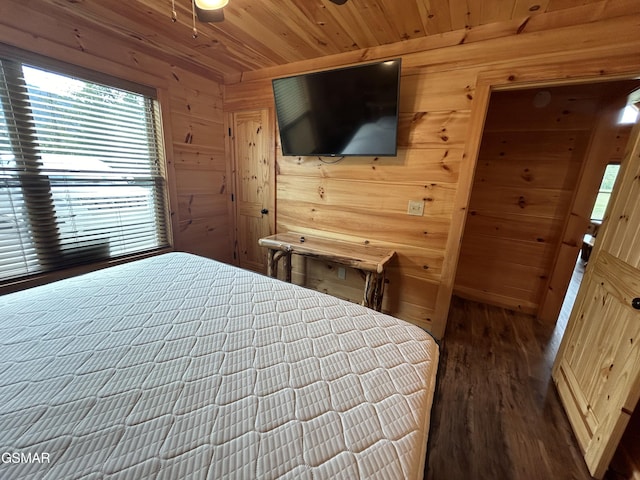 bedroom with hardwood / wood-style floors, wood walls, and wood ceiling