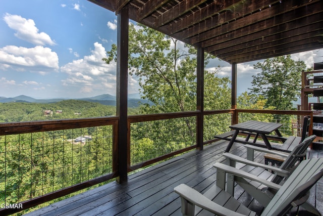 wooden deck featuring a mountain view