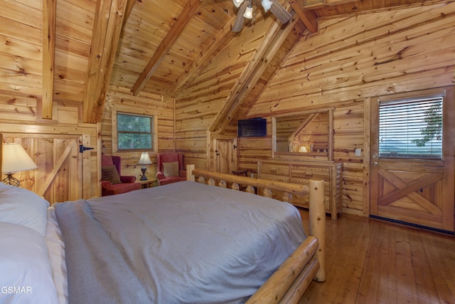 bedroom featuring vaulted ceiling with beams, wood-type flooring, wood walls, and wood ceiling