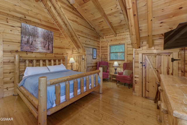 bedroom featuring light hardwood / wood-style floors, wood ceiling, wood walls, and vaulted ceiling with beams